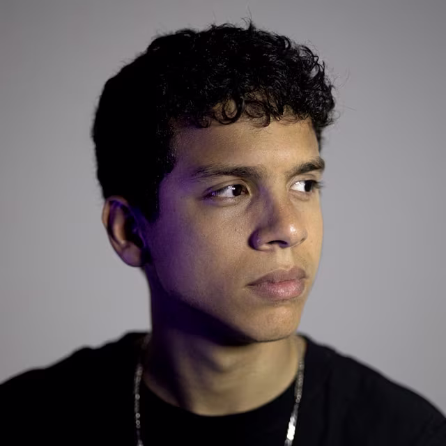 Portrait with smooth, even skin tone after AI retouching